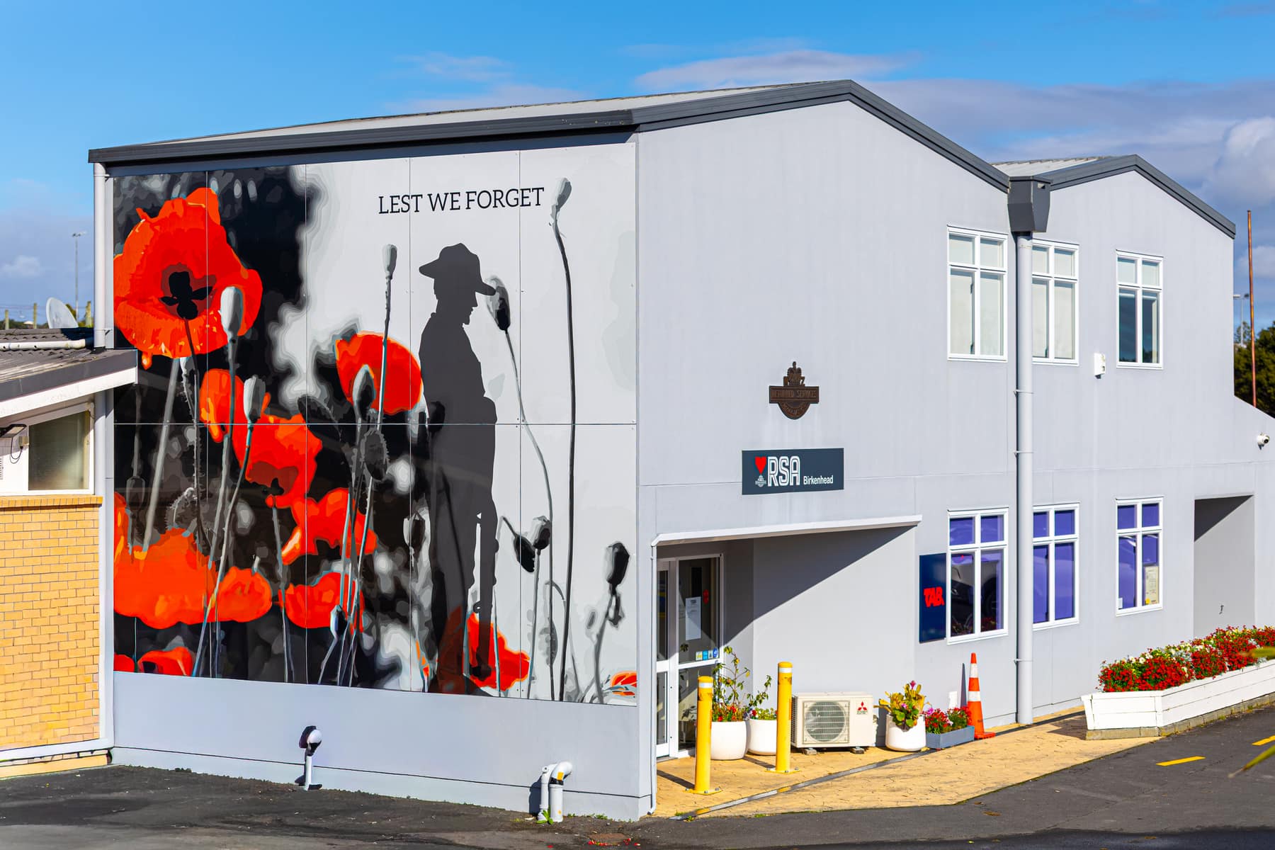 The Birkenhead RSA clubrooms, with the Lest We Forget poppy mural on the gable end