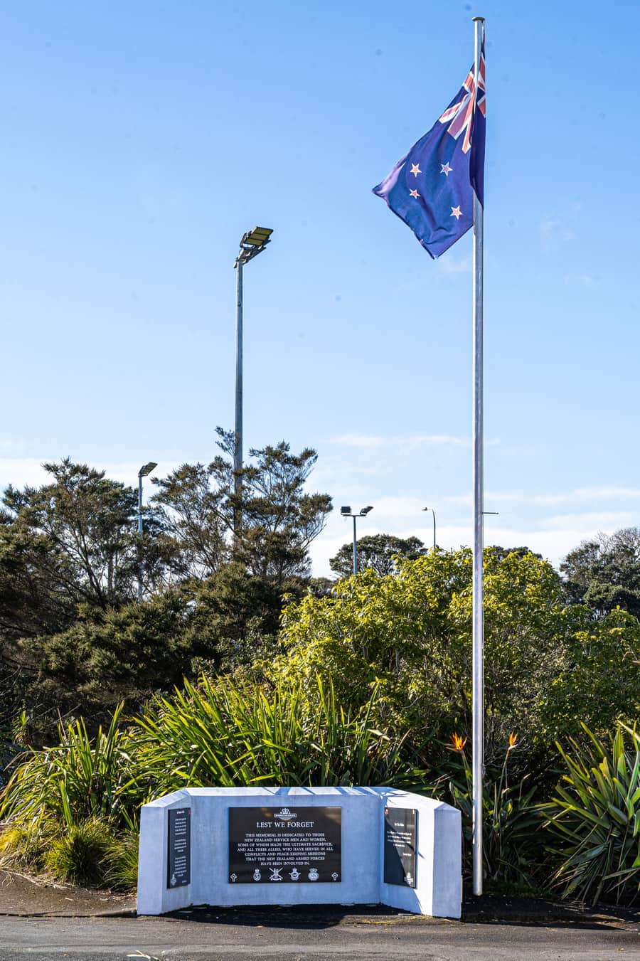 The Birkenhead RSA memorial, dedicated to New Zealand service men and women, beneath the New Zealand flag